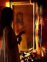 An amazing old lady is posing almost naked in stunning shots