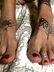 A well-endowed older woman is pleasuring herself